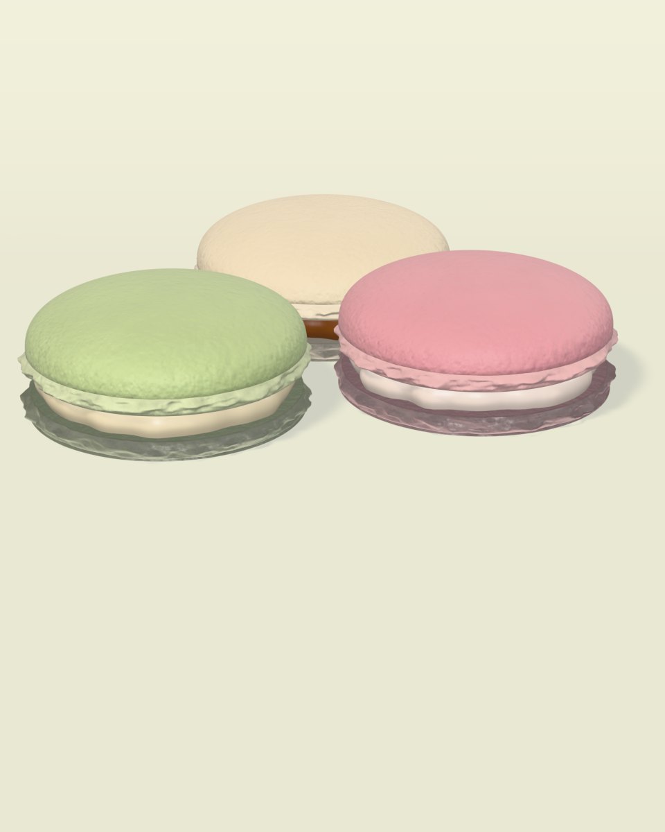 Three macarons in pistachio, raspberry and vanilla
