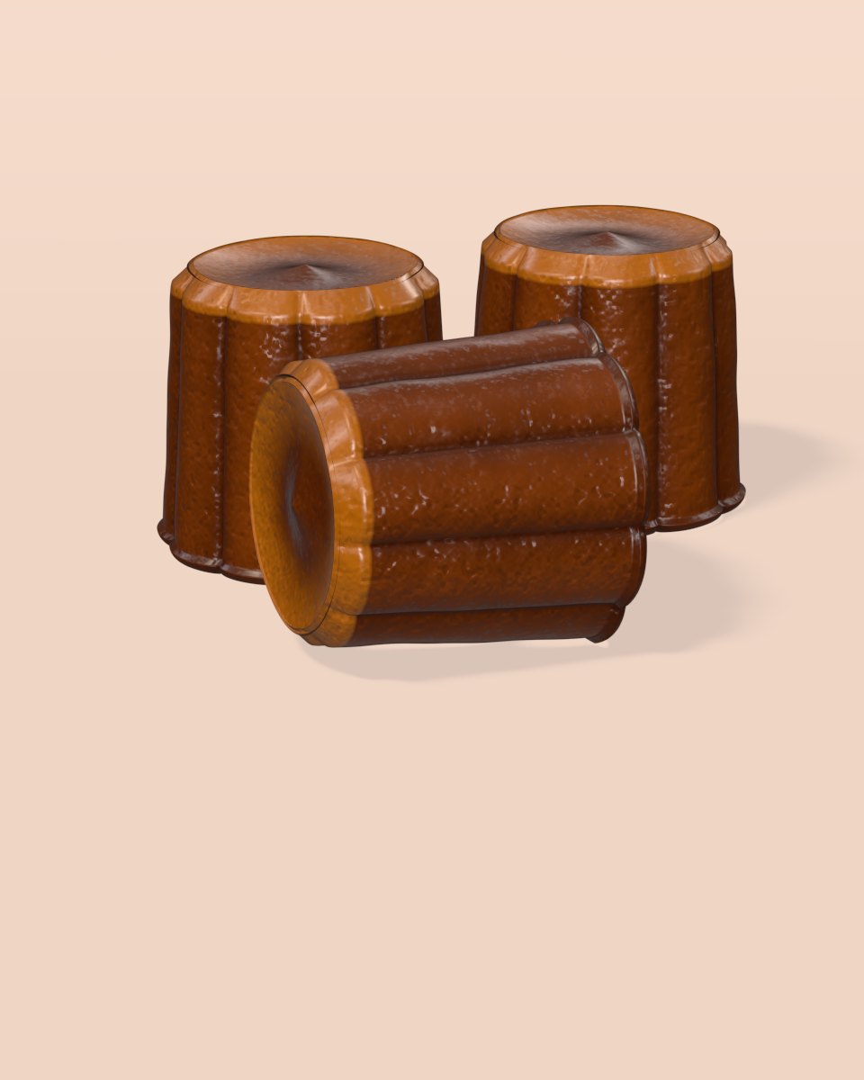 Three fluted canelés with dark caramelised crusts