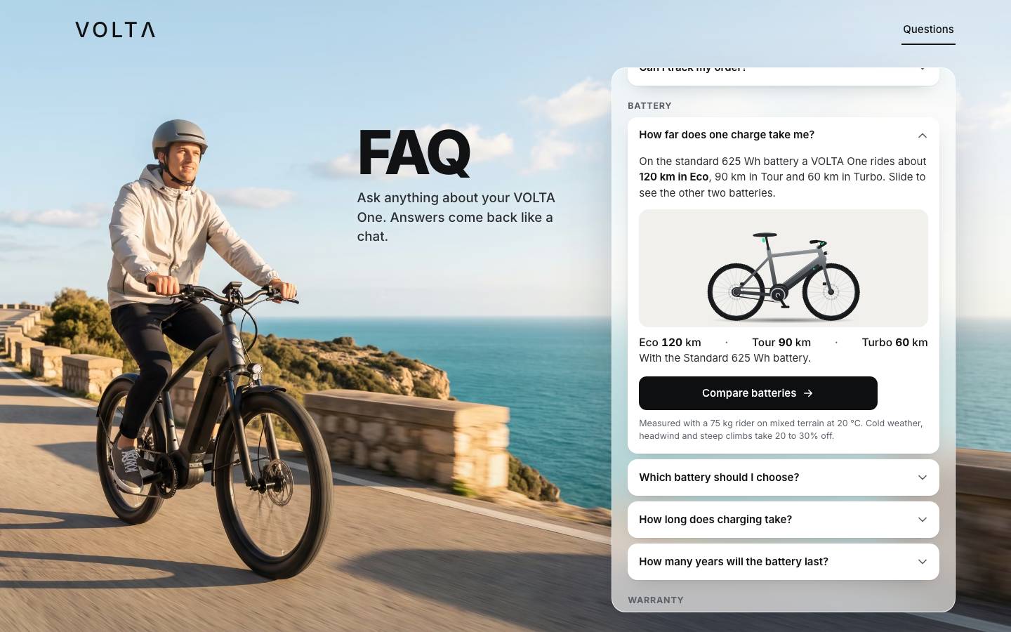 The VOLTA questions page with no JavaScript: a rider on a coastal road, the FAQ heading, and a frosted-glass panel listing the questions, the range question open with the bike, Eco 120 km, Tour 90 km, Turbo 60 km.